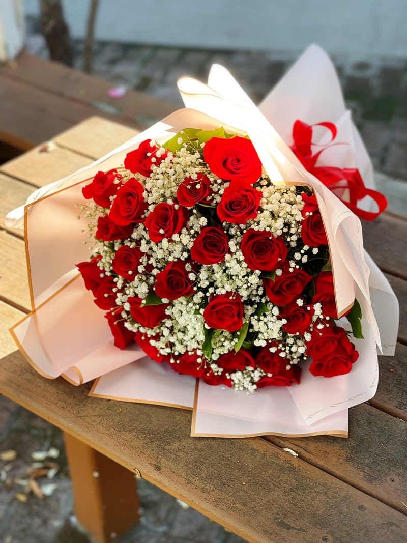 Two Dozen Red Roses Wrap with Baby's Breath